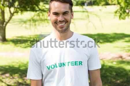 Composite image of handsome man pointing to his volunteer tshirt Stock photo © wavebreak_media