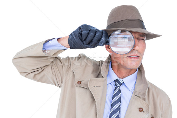 Spy looking through magnifier Stock photo © wavebreak_media
