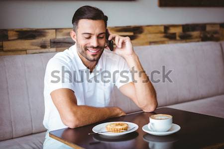 Young man smiling on the phone Stock photo © wavebreak_media