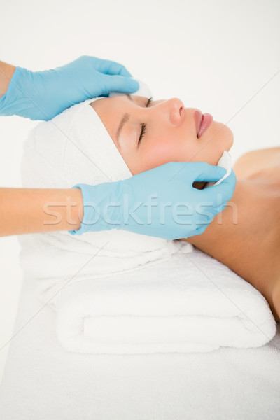 Stock photo: Hands cleaning woman face with cotton swabs