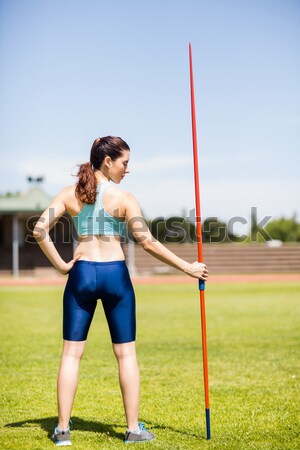 Full length of rugby player catching ball against blue sky Stock photo © wavebreak_media