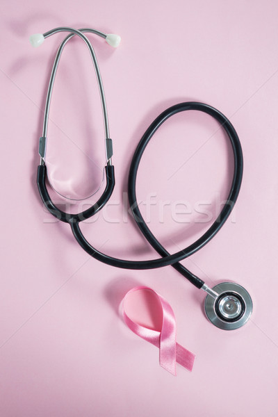 Directly above view of stethoscope by Breast Cancer Awareness ribbon Stock photo © wavebreak_media