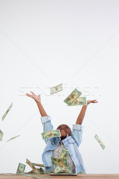 Cheerful businesswoman throwing paper currency in mid-air Stock photo © wavebreak_media