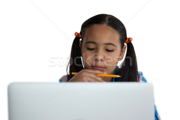 Thoughtful girl using laptop Stock photo © wavebreak_media