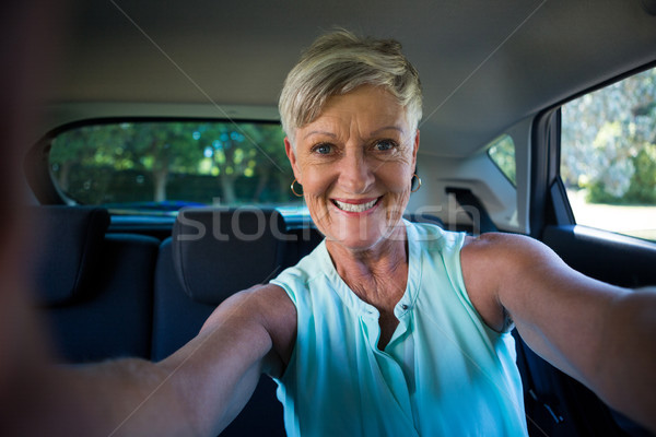 Heureux supérieurs femme à l'intérieur voiture portrait [[stock_photo]] © wavebreak_media