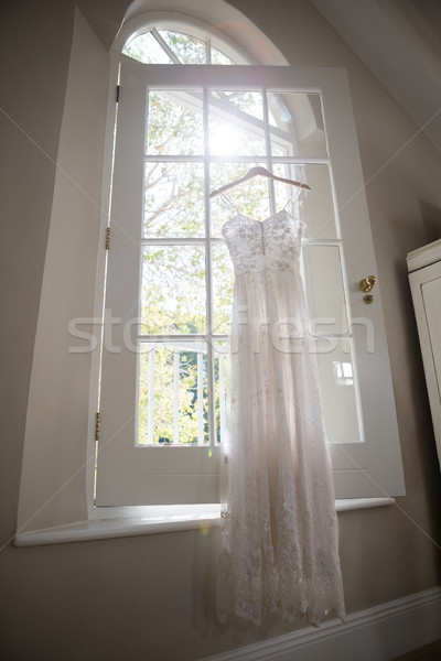 Robe de mariée suspendu fenêtre dressing mariage mode [[stock_photo]] © wavebreak_media