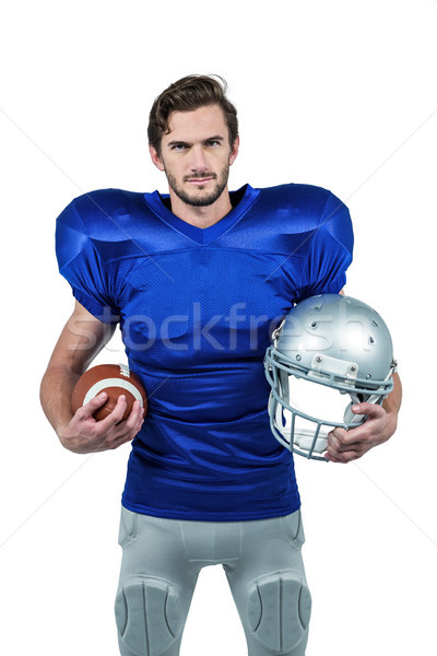 American football player holding helmet and ball Stock photo © wavebreak_media