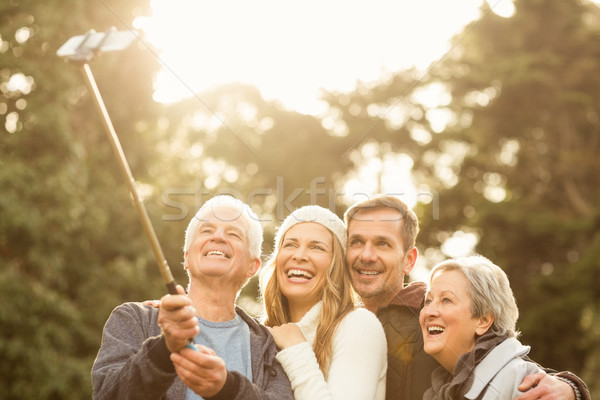 Souriant faible famille femme arbre [[stock_photo]] © wavebreak_media