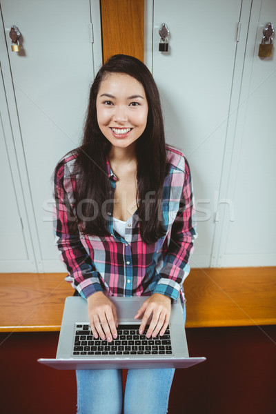 Smiling student sitting at the computer Stock photo © wavebreak_media