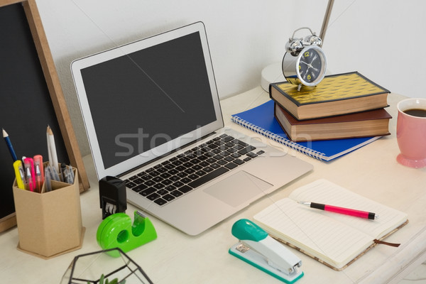 Stock photo: Laptop and various office accessories on table