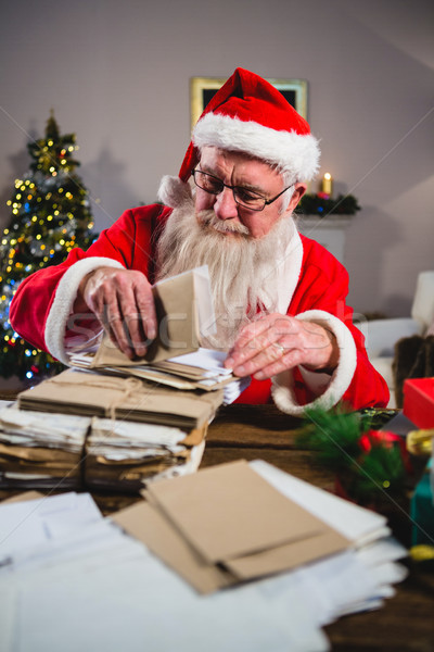 Santa Claus removing a letter Stock photo © wavebreak_media