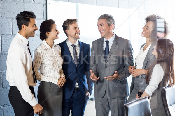 Businesspeople interacting in conference room Stock photo © wavebreak_media