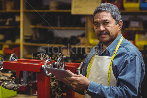 Shoemaker using digital tablet Stock photo © wavebreak_media