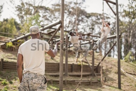 Stock photo: Military soldier during training exercise with weapon