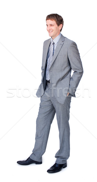 Smiling young businessman with hands in pockets Stock photo © wavebreak_media