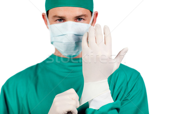 Charismatic surgeon wearing surgical gloves  Stock photo © wavebreak_media