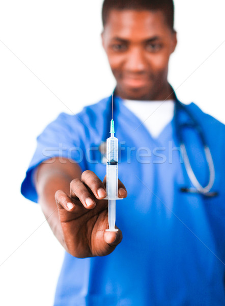 Stock photo: Doctor holding a syringe