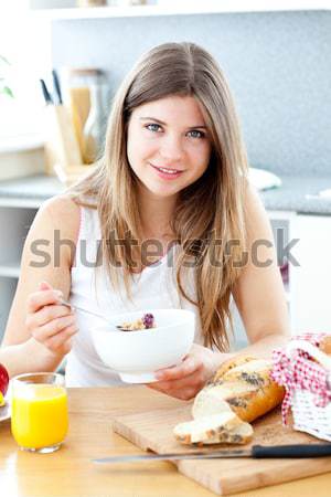 Portrait of a bright young mother preparing food for her baby in the kitchen Stock photo © wavebreak_media