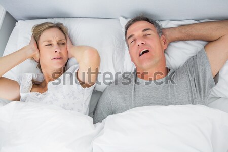 Peaceful couple sleeping in their bedroom Stock photo © wavebreak_media