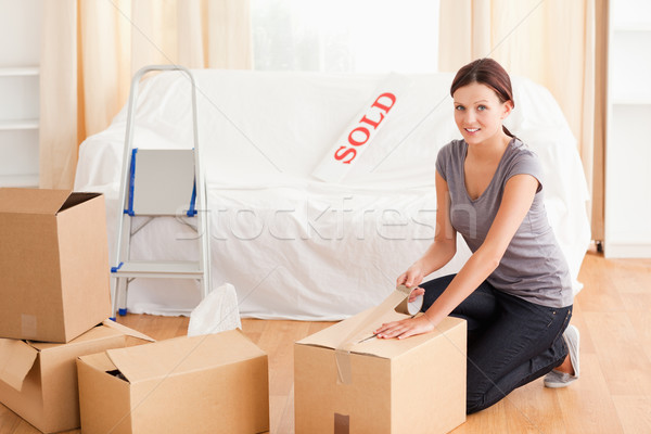 A female is preparing a cardboard box for the transport Stock photo © wavebreak_media