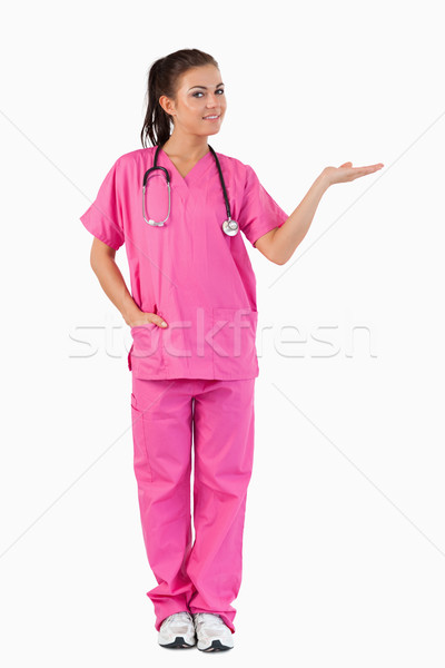 Portrait of a female doctor presenting a copy space against a white background Stock photo © wavebreak_media