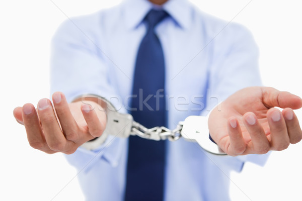Close up of a professional's hands with handcuffs against a white background Stock photo © wavebreak_media