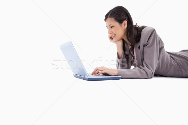 Vista lateral mulher usando laptop branco negócio computador Foto stock © wavebreak_media