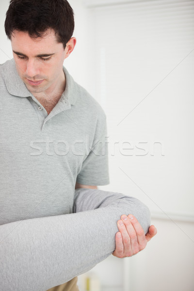 Brunette physiotherapist stretching a leg in a room Stock photo © wavebreak_media