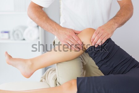 Knee of a woman being massaged by a physiotherapist in a room Stock photo © wavebreak_media