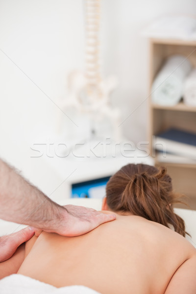 Woman being massaged while lying on the belly in a room Stock photo © wavebreak_media