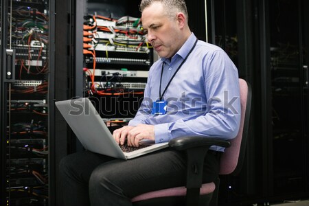 Technician looking up from making notes on server Stock photo © wavebreak_media