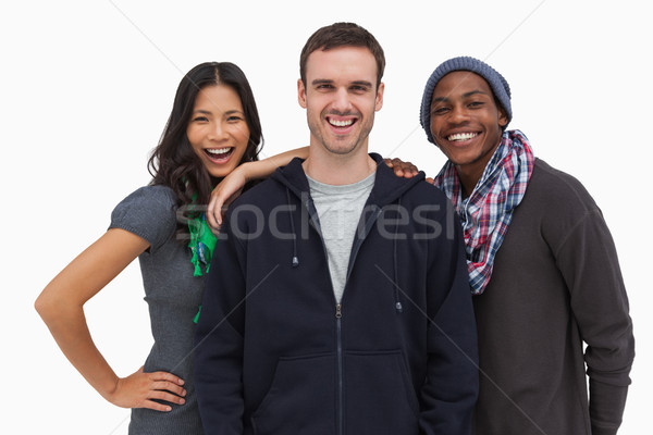Stylish young friends smiling at camera Stock photo © wavebreak_media