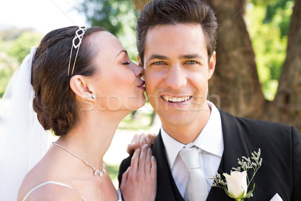 Bride kissing groom on cheek in garden Stock photo © wavebreak_media