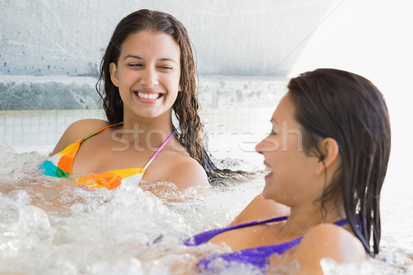 Sorridere amici rilassante vasca idromassaggio spa bikini Foto d'archivio © wavebreak_media