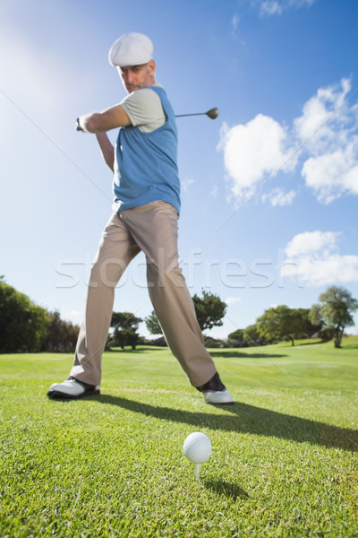 Golfer swinging his club on the course Stock photo © wavebreak_media