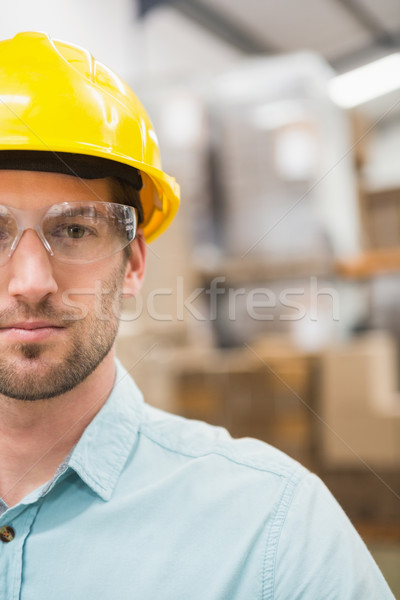 Close up of worker wearing hard hat in warehouse Stock photo © wavebreak_media