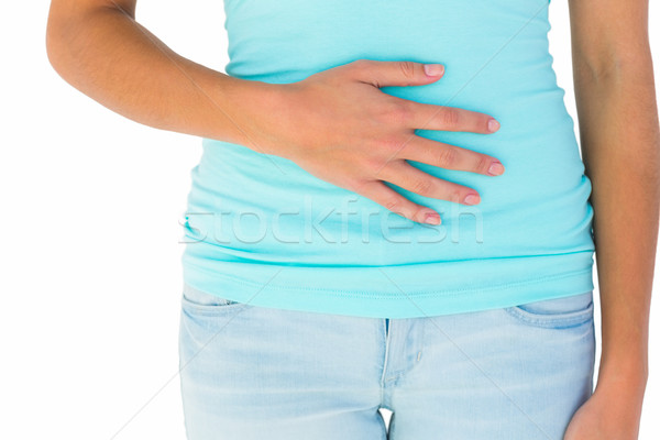 Subtire femeie mână stomac alb femeie Imagine de stoc © wavebreak_media
