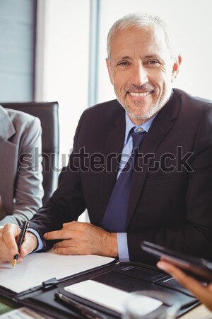 Focused businessman using his laptop Stock photo © wavebreak_media