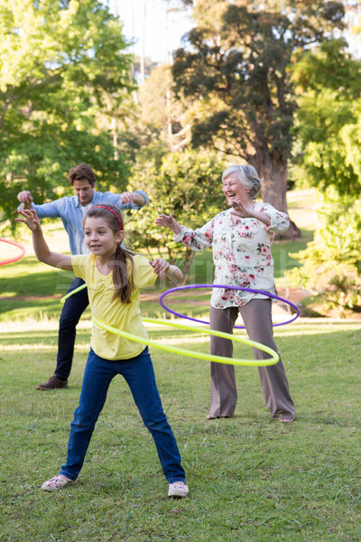 Extended family playing with hula hoops Stock photo © wavebreak_media