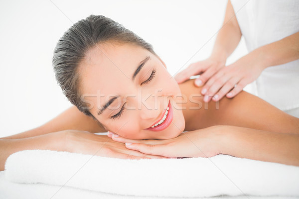Attractive woman receiving back massage at spa center Stock photo © wavebreak_media