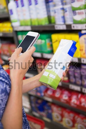 Stock photo: Smiling woman taking meal in the aisle