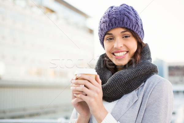 Smiling woman with take-away coffee Stock photo © wavebreak_media