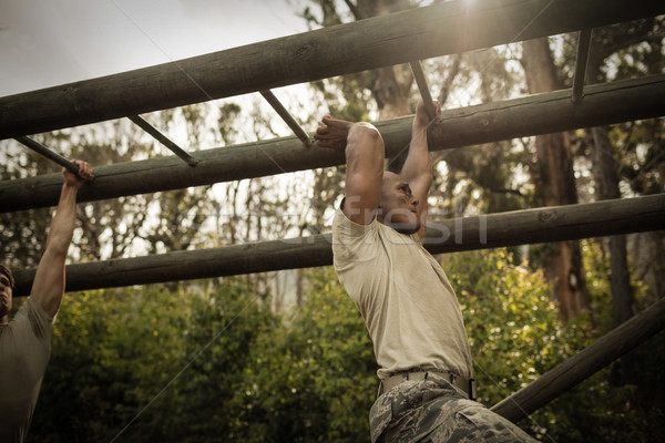 Soldier climbing monkey bars Stock photo © wavebreak_media