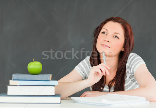 Young student writting an essay in a classroom Stock photo © wavebreak_media