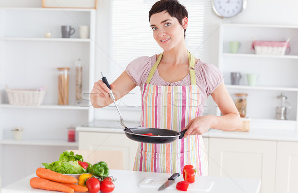 Stock photo: Gorgeous woman cooking in the kitchen