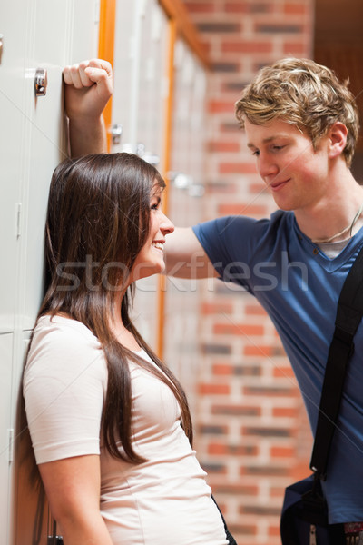 Portrait of a student couple flirting in a corridor Stock photo © wavebreak_media
