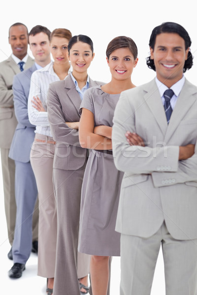 Close-up of a business team in a single line crossing their arms with focus on the first woman Stock photo © wavebreak_media