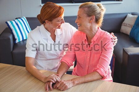 Stock photo: Lecturer checking students work in classroom