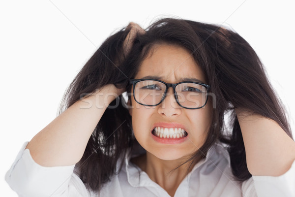 Worried woman putting her hand on the head in the white background Stock photo © wavebreak_media
