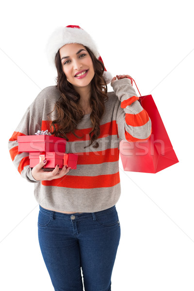 Lächelnd Brünette halten Geschenke Einkaufstasche Stock foto © wavebreak_media